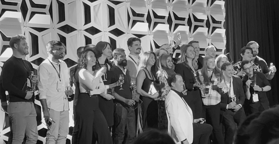 CSE folks on stage collecting the TEAM award